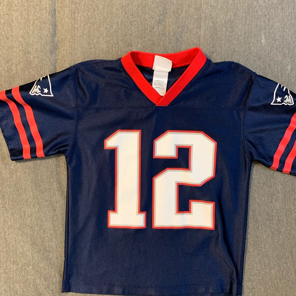 Tom Brady boys size large patriots jersey.